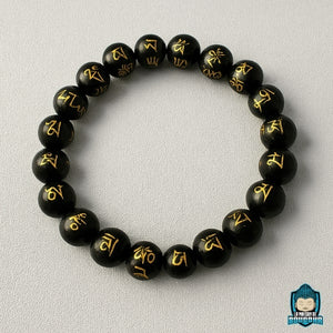 Bracelet-Onyx-Mantra-Tibétain-perles-noires-gravées-de-mantras-couleur-or-perles-polies-10-mm-La-Maison-de-Bouddha