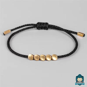 Bracelet-Tresse-Tibetain-Rouge-et-Perles-de-Cuivre-Noir-La-Maison-de-Bouddha