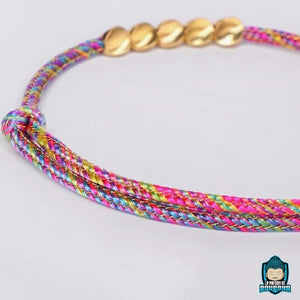 Bracelet-Tressé-Tibétain-Rouge-et-Perles-de-Cuivre-ajustable-Arc-en-Ciel-La-Maison-de-Bouddha