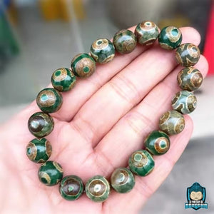 Bracelet-tibetain-en-perles-Dzi-Talisman-de-protection-et-prosperite-bouddhiste-perles-naturelles-agate-fabrication-artisanale-La-Maison-de-Bouddha