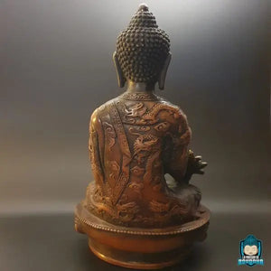 statue-bouddha-medecine-assis-sur-une-fleur-de-lotus-drape-kesa-dragon-gravee-La-Maison-de-bouddha