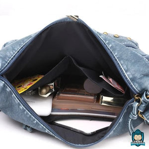 Sac-Cuir-Bandoulière-pour-Femme-Bleu-Jean-1-grande-poche-principale-2-petites-pochettes-ouvertes-1-petite-poche-zippée-doublure-polyester-La-Maison-de-Bouddha