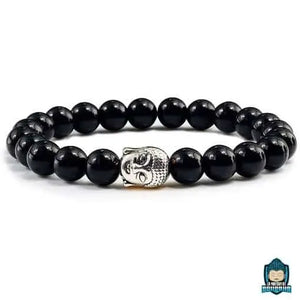 Bracelet-Bouddha-Pierre-de-Lave-medaillon-tete-de-Bouddha-argente-perles-de-couleur-noires-brillantes-vernies-sur-fond-blanc-La-Maison-de-Bouddha