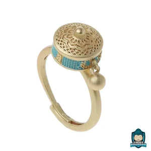 bague-tibetaine-tournante-couleur-or-et-turquoise-en-laiton-redimensionnable-La-Maison-de-Bouddha